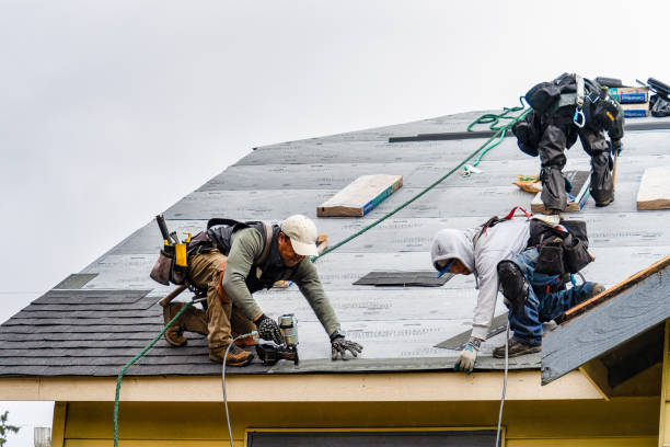 Professional Gutter Installation technician working in Graham, WA